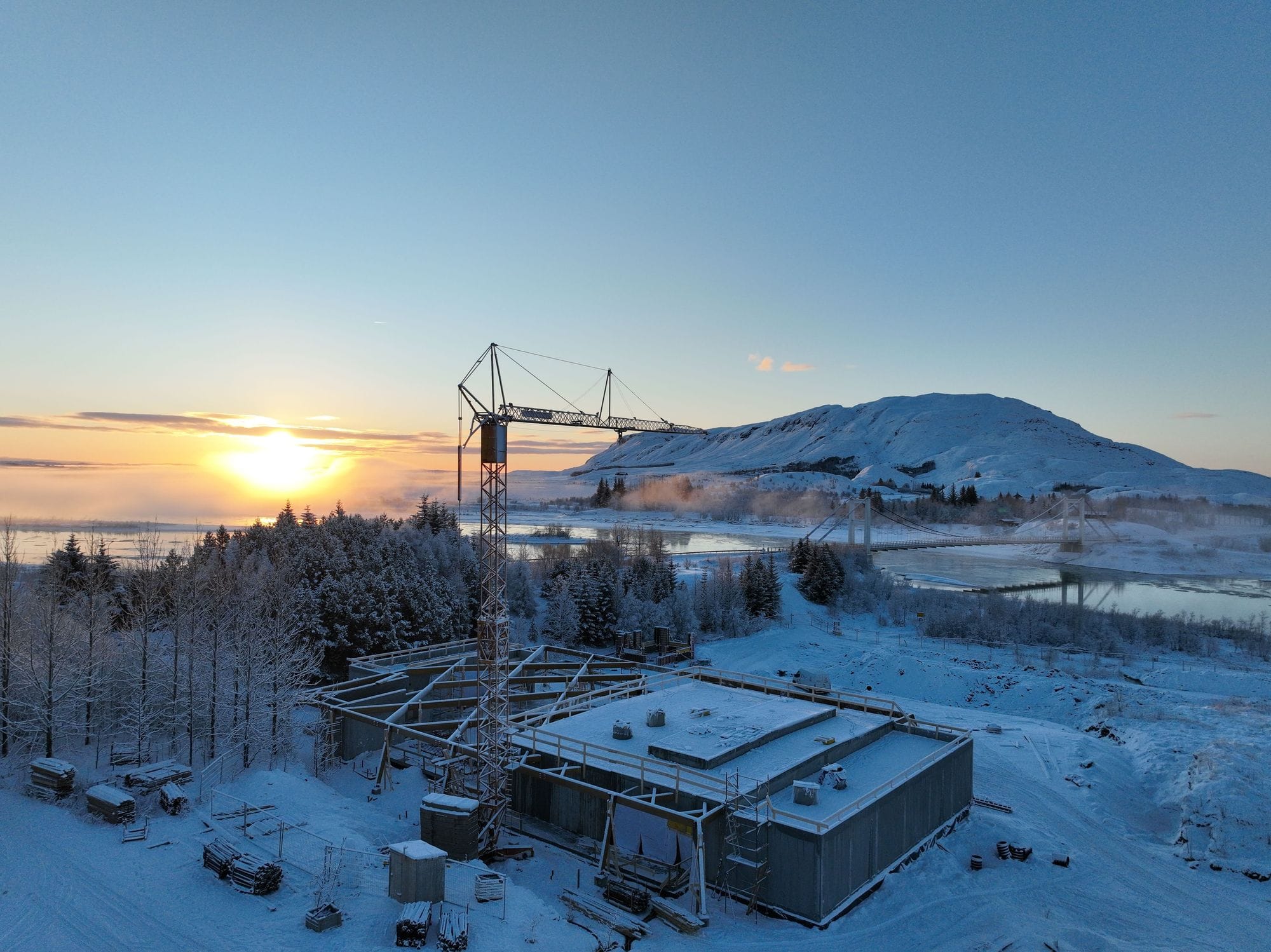 Laugarás lagoon being built during winter