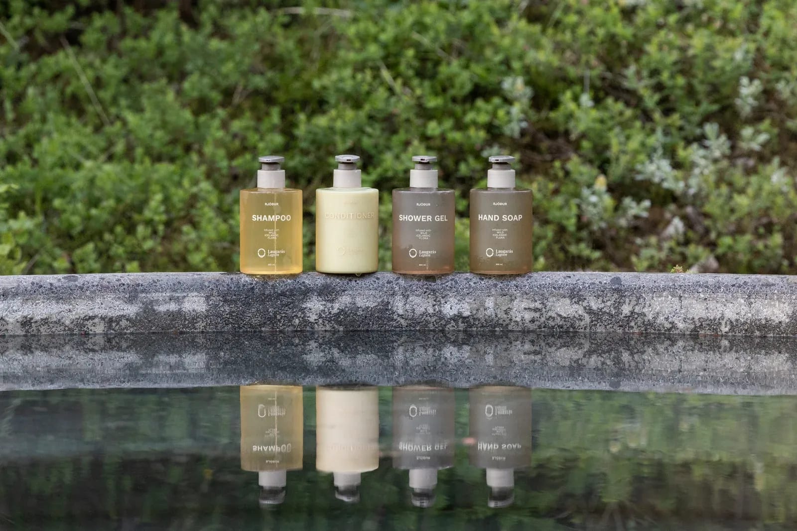 Products on the edge of the forest pool in Laugarás Lagoon
