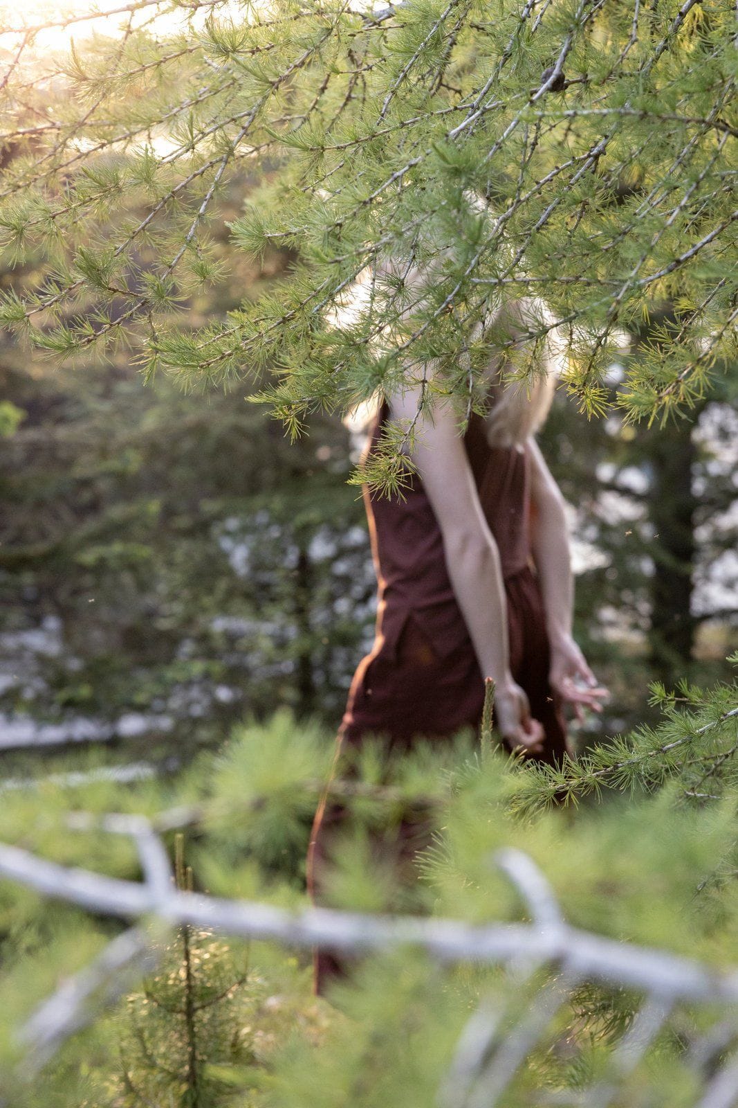 Person running in the forest clearing in Laugarás Lagoon
